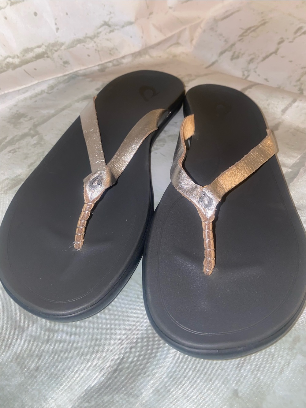 OluKai Black Sandal with Metallic Rose Gold Straps